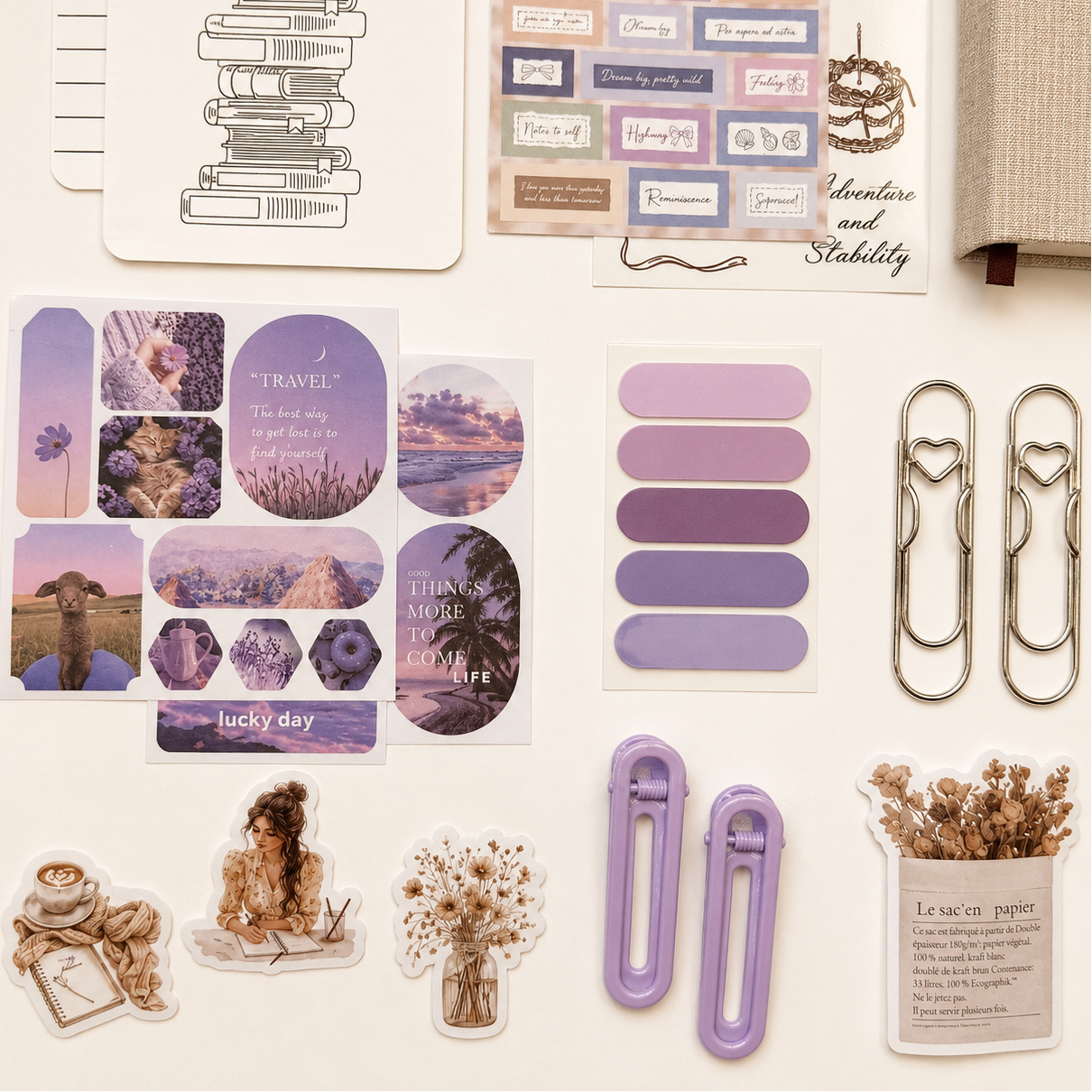 Collection of decorative stickers, paper clips, and a small stickers on a light background