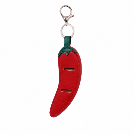 Red chili pepper-shaped keychain with green stem on a white background