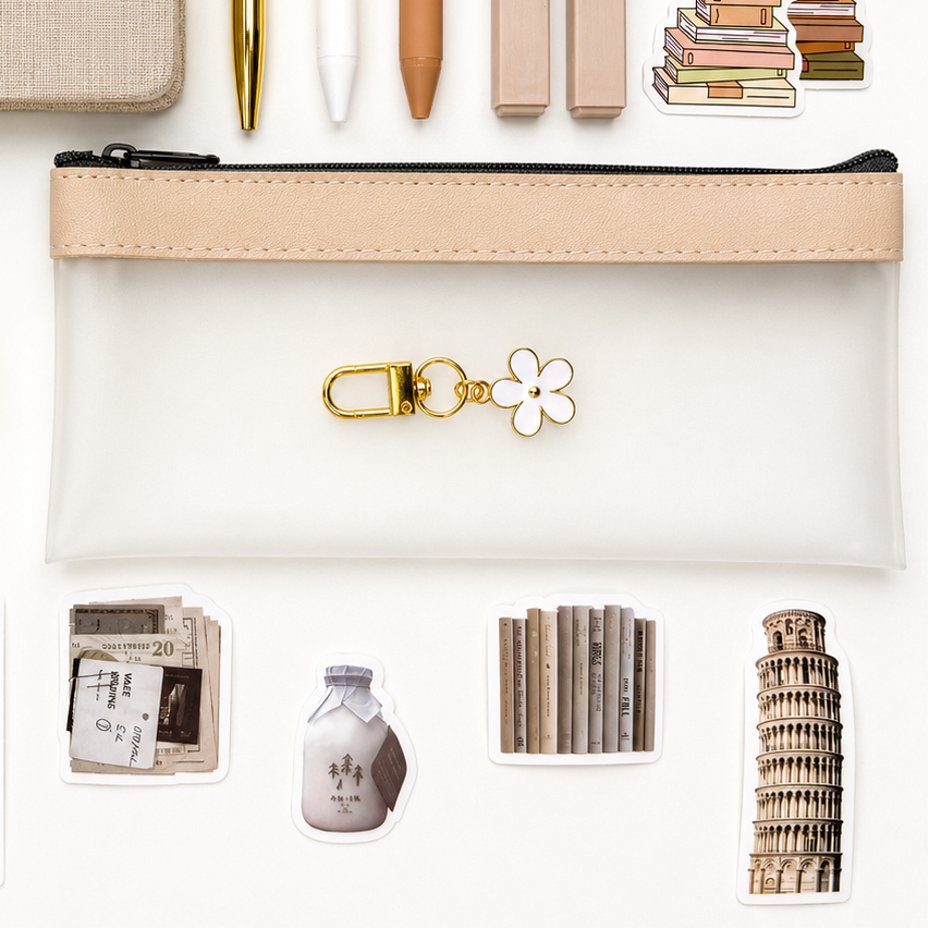 Transparent pencil pouch with flower charm and neutral travel-inspired stickers