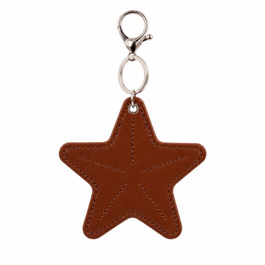 Brown star-shaped keychain with a silver clasp on a white background