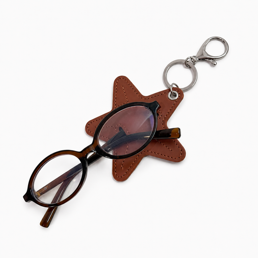 Star-shaped glasses case with a pair of glasses on a white background