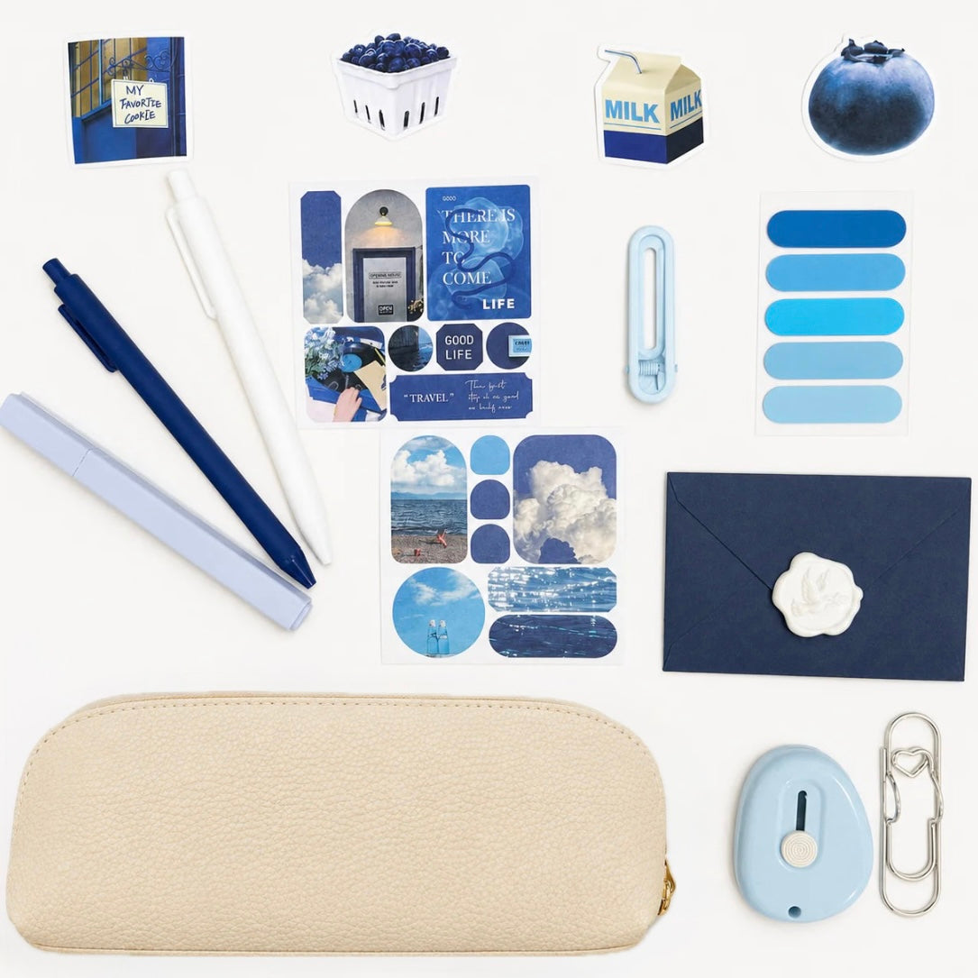 Collection of stationery items with a blue color theme on a white background