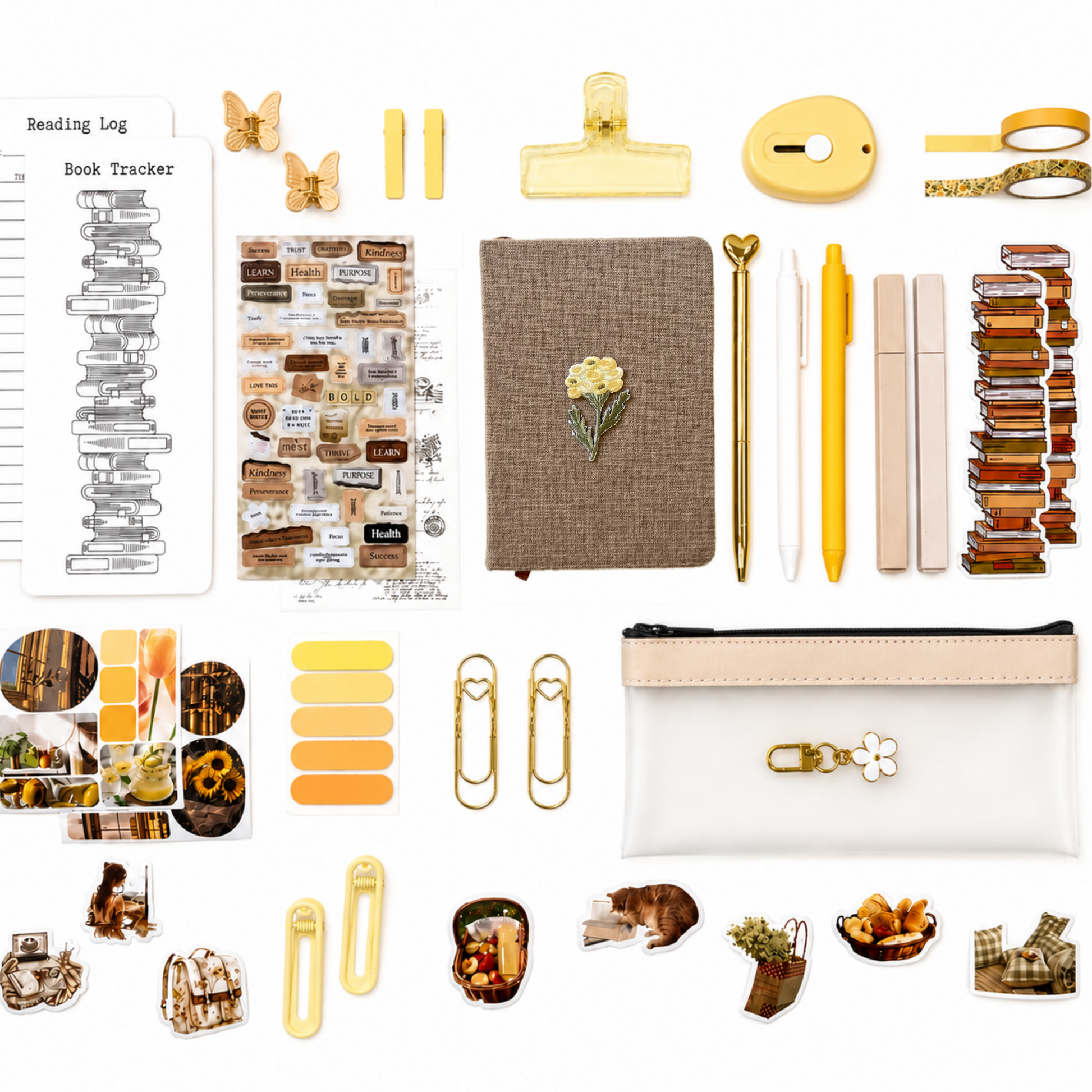Collection of stationery items including a notebook, pen, clips, and decorative elements on a white background.